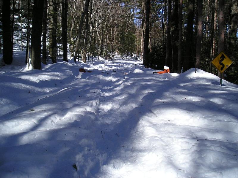 P1010007.JPG - Once we got on the road we followed the snowmobile tracks to the summit. The snow was deep enough to bury the winter gate.